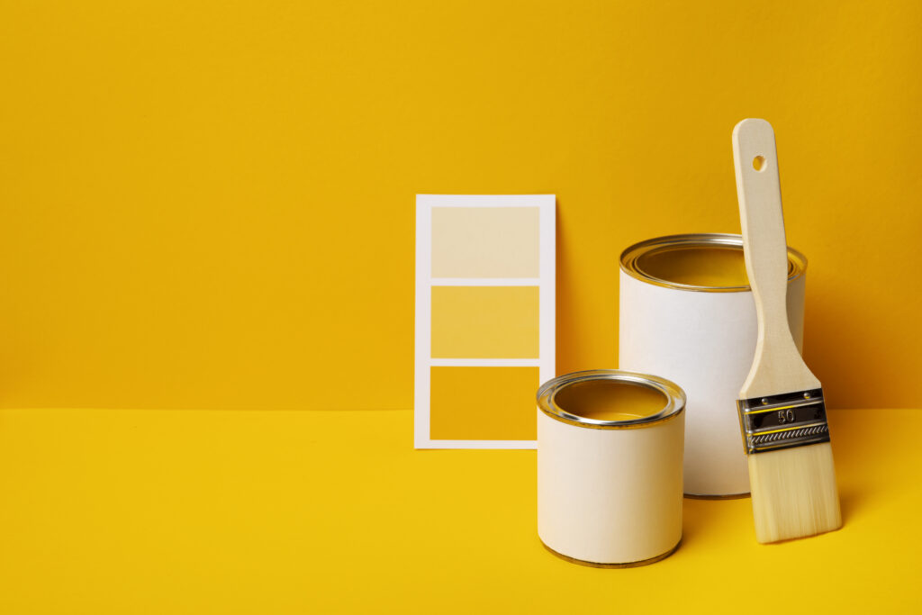 cans with yellow paint high angle
